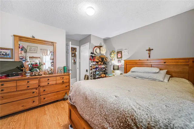 a bedroom with a bed and a dresser in it