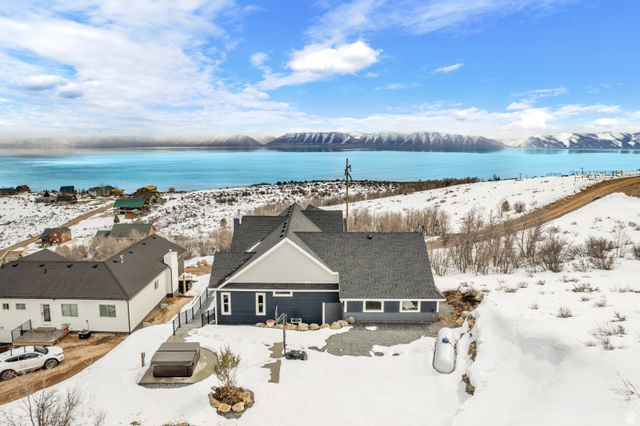1343 North Trapper Loop Garden City, UT 84028 - Photo 51 of 56 Snowy aerial view featuring a mountain view