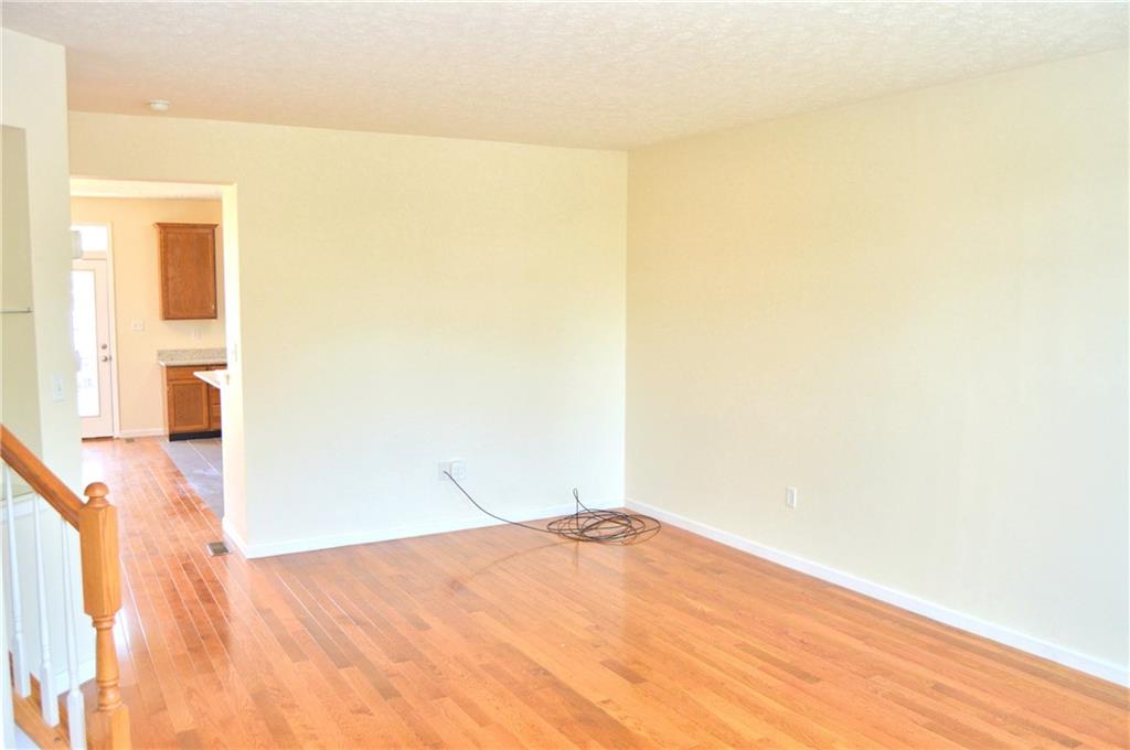 2001 Village Run Road Wexford, PA 15090 - Photo 6 of 25 Living room with built-in shelves and powder room.