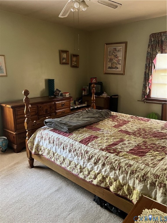 6809 River Road Petersburg, VA 23803 - Photo 7 of 9 a bedroom with a bed and furniture