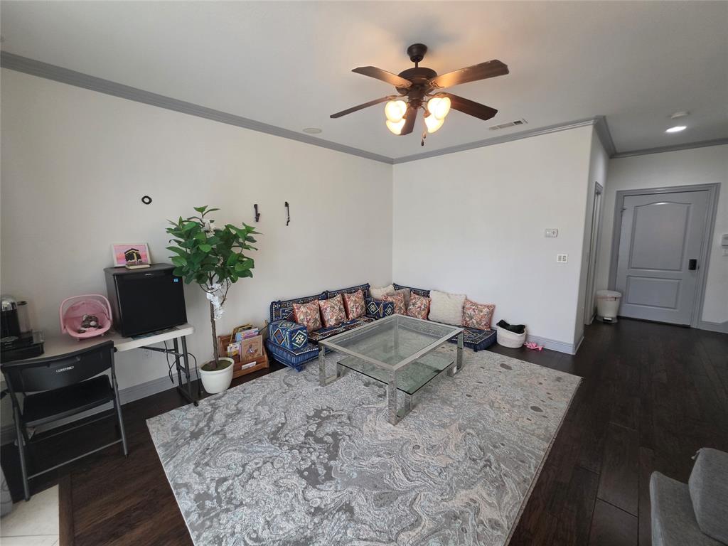 809 Rockingham Drive Irving, TX 75063 - Photo 15 of 30 Dark wood-finish flooring, ceiling fan with integrated lighting, recessed lighting, white walls with gray trim, and a paneled interior door