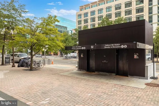 a black car parked in front of building