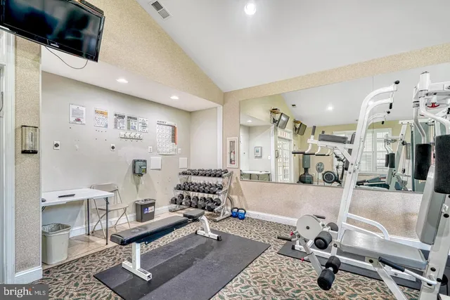 a view of a kitchen with sink and cabinets