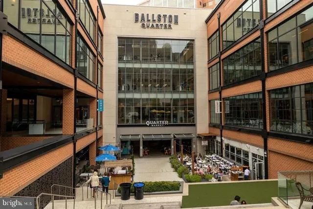 a street with a building and a street light on the road