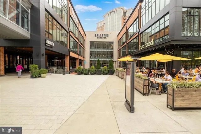 a front view of a building with pots