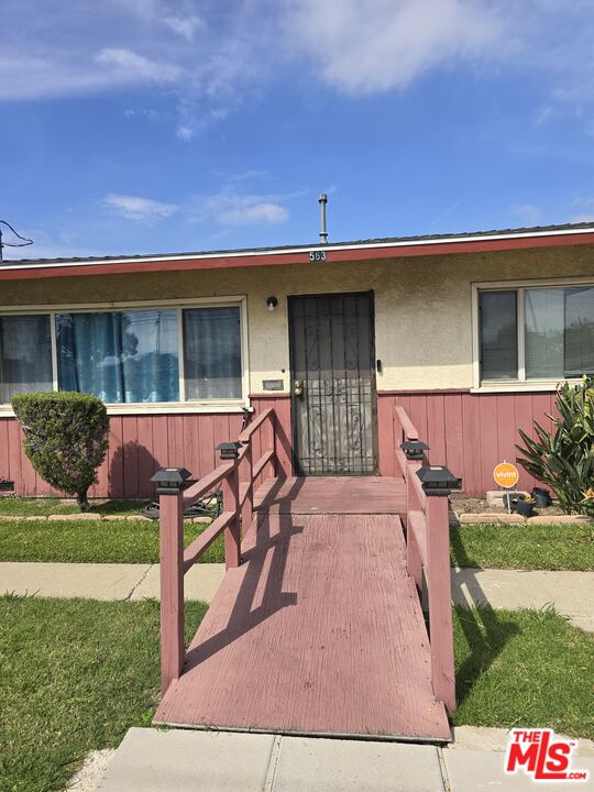 563 East 223rd Street Carson, CA 90745 - Photo 2 of 6 a front view of a house with garden