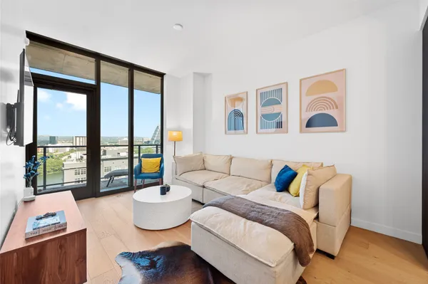 a bedroom with a bed and glass window