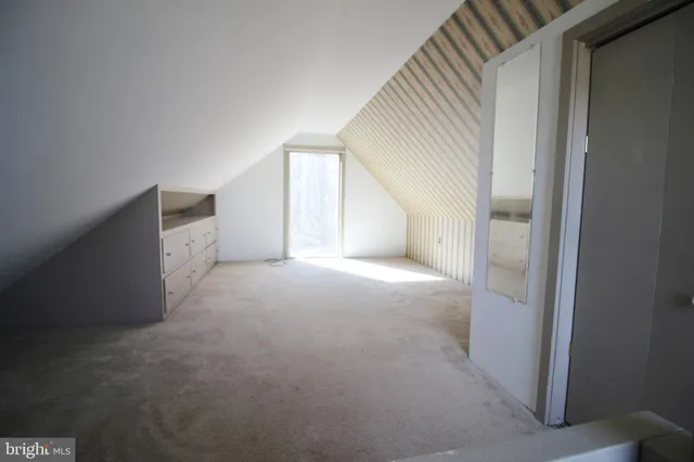 a view of an empty room and stairs
