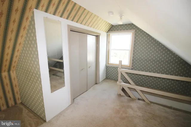 a view of a room with a staircase