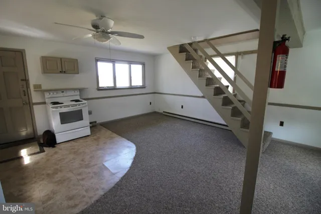 a kitchen with a refrigerator and a sink