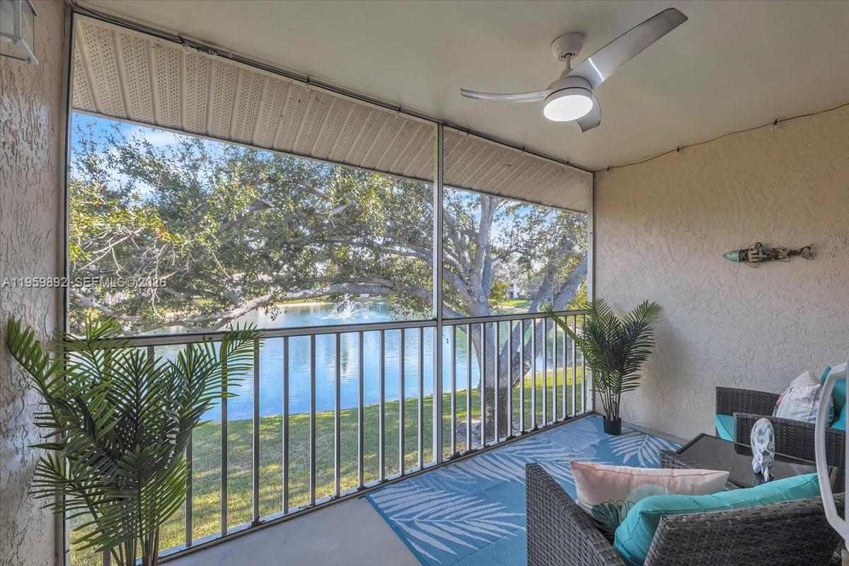 280 Timber Lake Circle, Unit 201 Naples, FL 34104 - Photo 21 of 34 a balcony with furniture and a swing