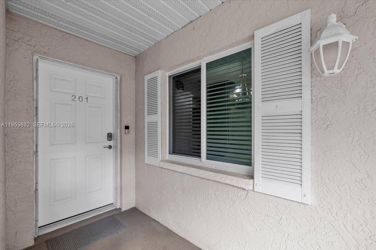 280 Timber Lake Circle, Unit 201 Naples, FL 34104 - Photo 25 of 34 a view of a backyard of a house