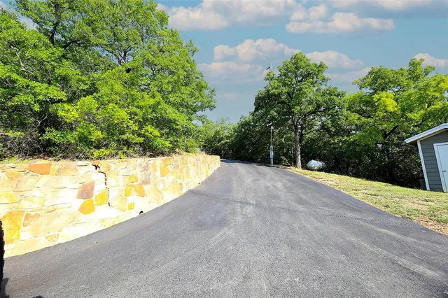 a view of a swimming pool with a yard