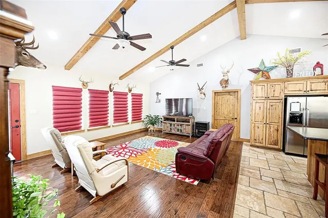 a balcony with furniture and wooden floor