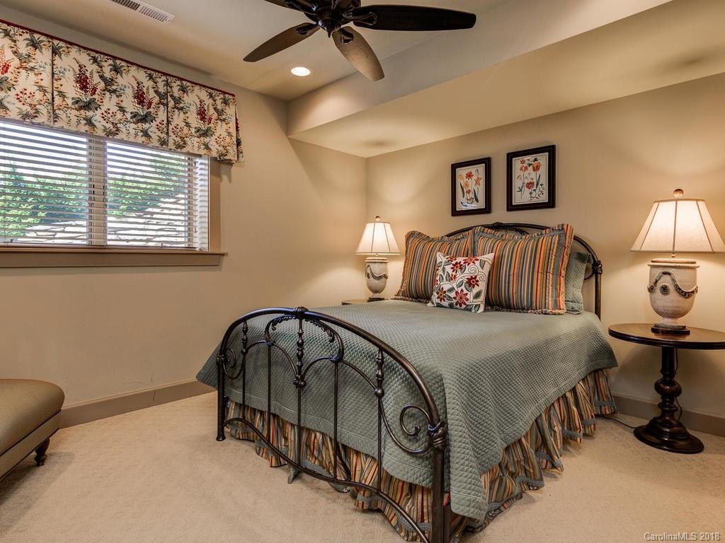 462 Dry Pond Road Marshall, NC 28753 - Photo 14 of 36 a bedroom with a bed and a painting on the wall