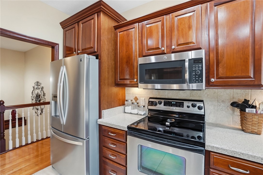 710 Governors Road Troy, OH 45373 - Photo 12 of 56 This functional kitchen features rich wooden cabinetry and modern stainless steel appliances.