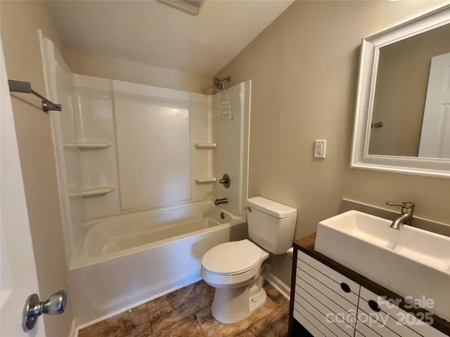 a bathroom with a sink a toilet and a bathtub