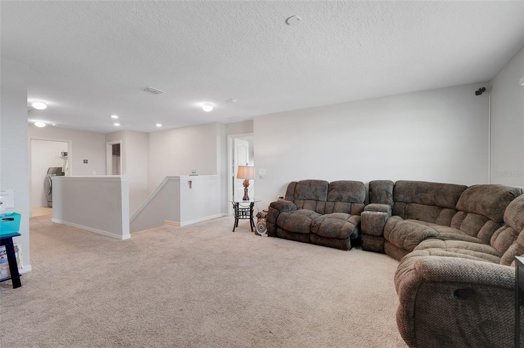 2111 Ficus Street Mascotte, FL 34753 - Photo 13 of 24 a living room with furniture and a couch