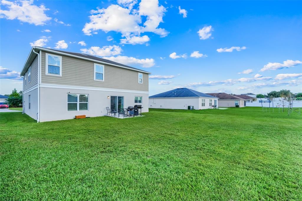 2111 Ficus Street Mascotte, FL 34753 - Photo 21 of 24 a view of a house with a backyard