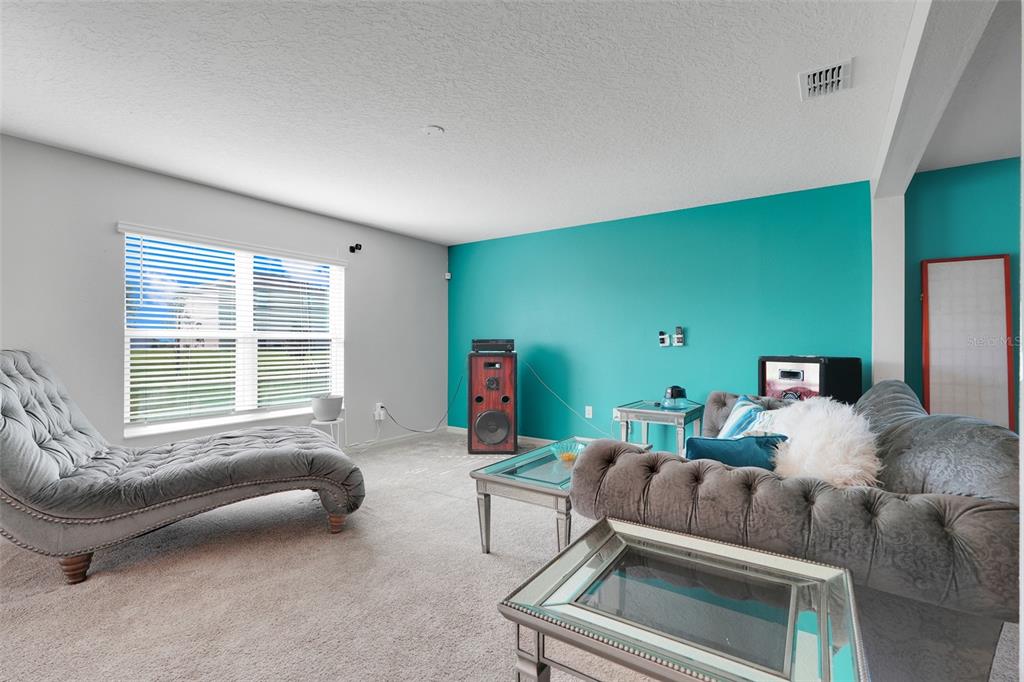 2111 Ficus Street Mascotte, FL 34753 - Photo 7 of 24 a living room with furniture and a window