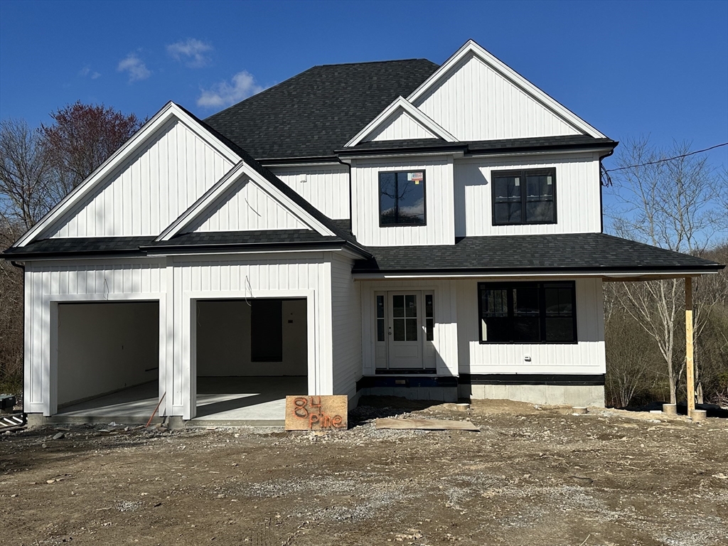 a front view of a house with garage
