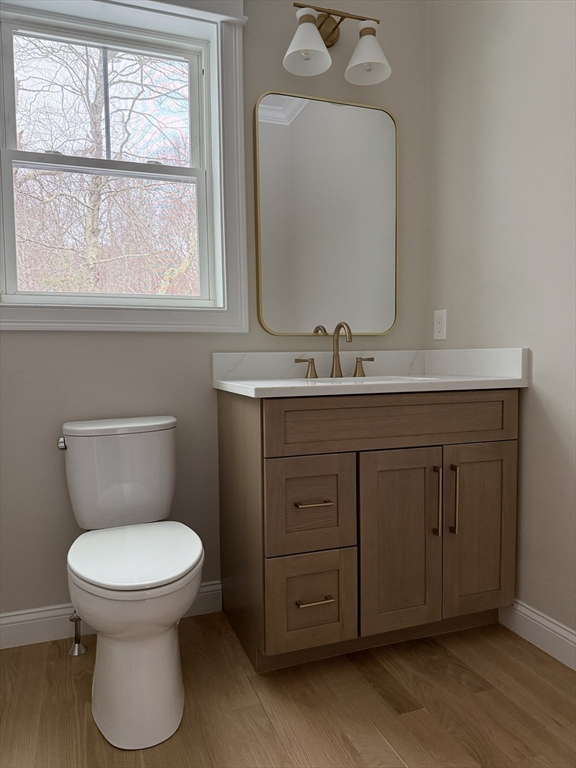 84 Pine Street Rehoboth, MA 02769 - Photo 11 of 29 a bathroom with a toilet sink and mirror