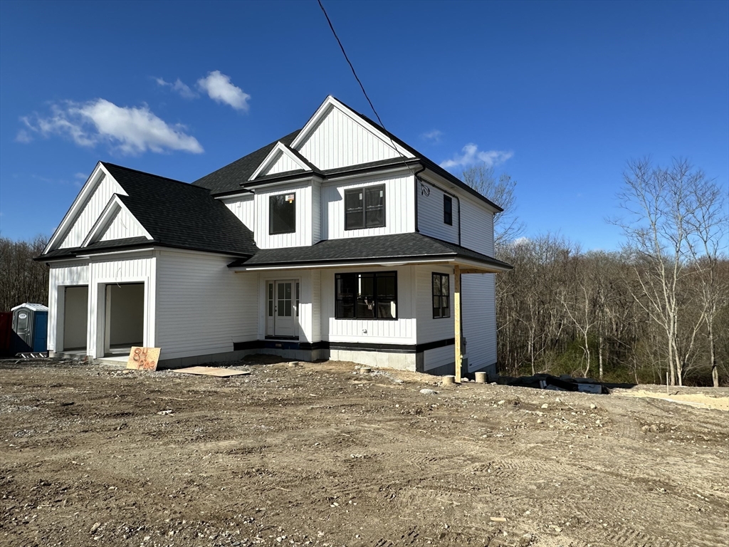 84 Pine Street Rehoboth, MA 02769 - Photo 3 of 29 a front view of a house with a yard