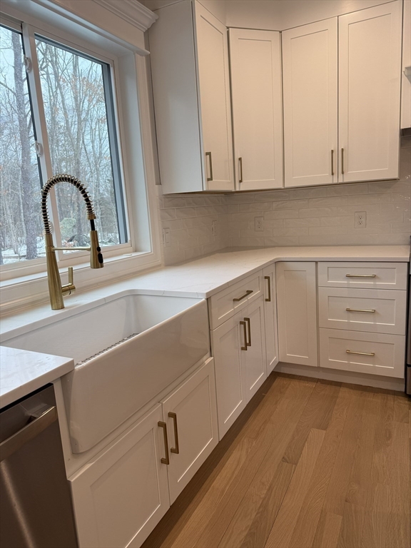 84 Pine Street Rehoboth, MA 02769 - Photo 5 of 29 a view of a kitchen with cabinets and a wooden floor