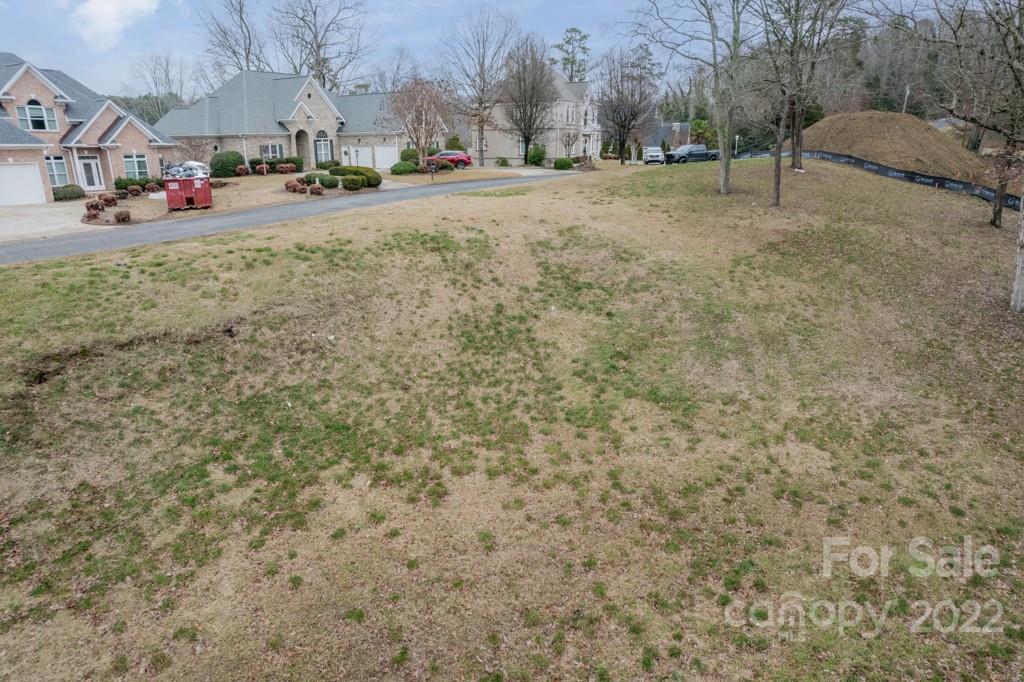14007 Point Lookout Road Charlotte, NC 28278 - Photo 15 of 19 a view of road with card parked on the roadside