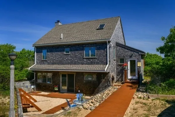 a front view of a house with yard