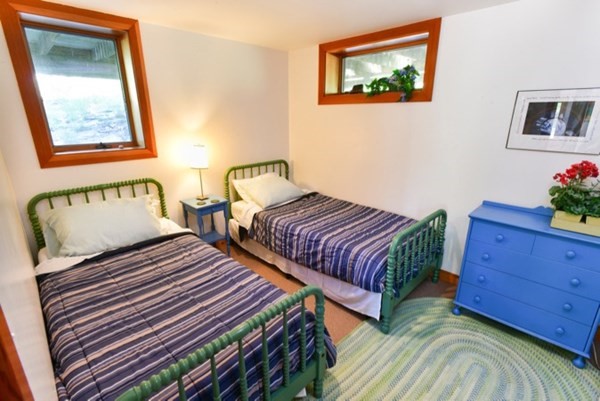19 Lighthouse Road Aquinnah, MA 02535 - Photo 9 of 13 a bedroom with two beds and a window