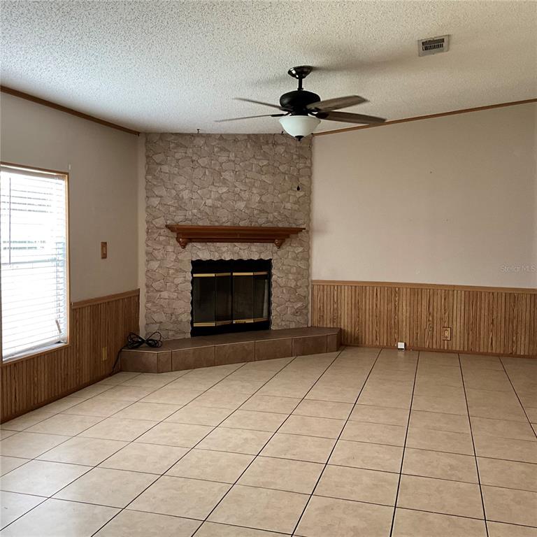 116 Traders Cove Boulevard DeBary, FL 32713 - Photo 22 of 60 a view of an empty room with a fireplace