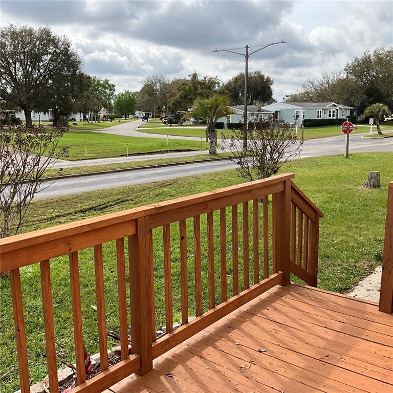 116 Traders Cove Boulevard DeBary, FL 32713 - Photo 29 of 60 a view of a deck with a big yard