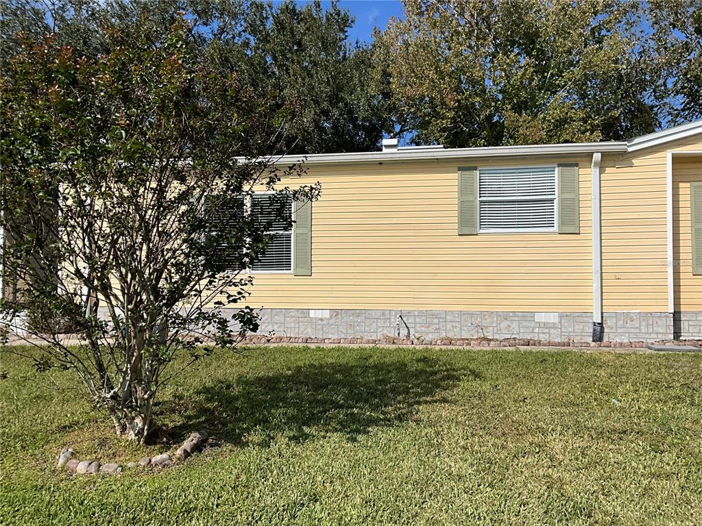116 Traders Cove Boulevard DeBary, FL 32713 - Photo 3 of 60 a view of a house with a yard