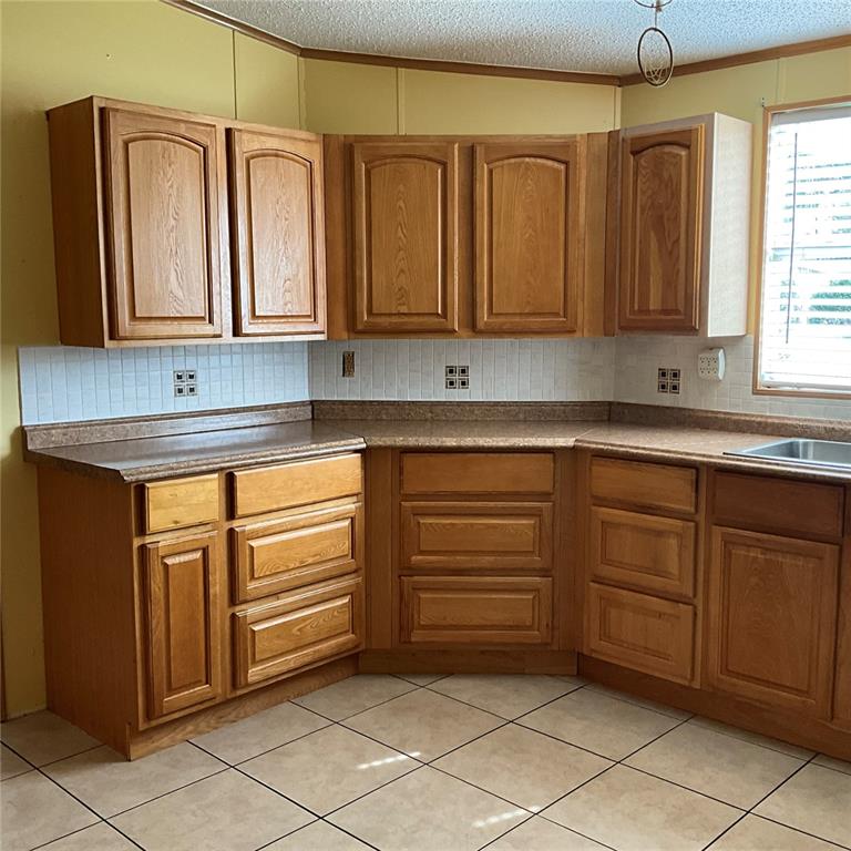 116 Traders Cove Boulevard DeBary, FL 32713 - Photo 34 of 60 a kitchen with stainless steel appliances granite countertop a sink and dishwasher with white cabinets