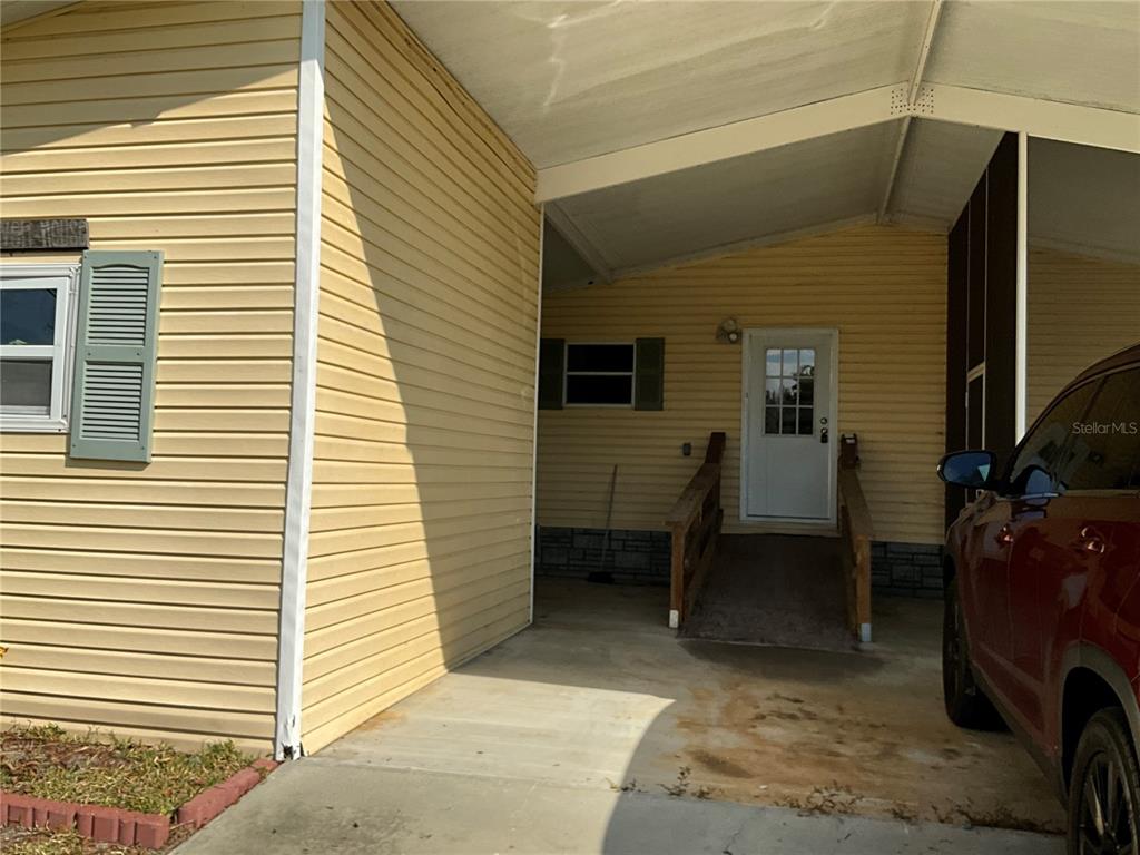 116 Traders Cove Boulevard DeBary, FL 32713 - Photo 4 of 60 a view of a balcony with chairs and a barbeque
