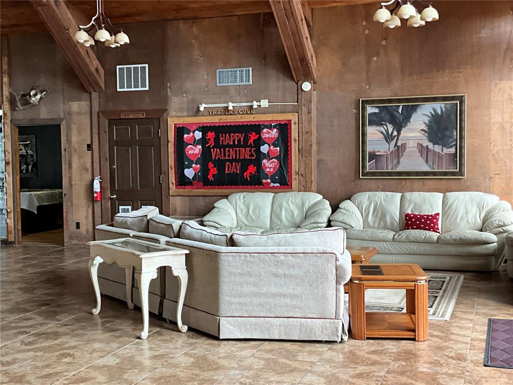 116 Traders Cove Boulevard DeBary, FL 32713 - Photo 55 of 60 a living room with furniture a dining table and chairs