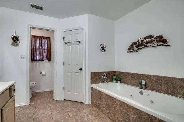 a bathroom with a bathtub and a sink