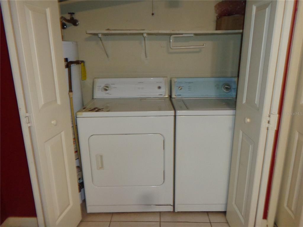 1120 Southwest 19th Place Gainesville, FL 32601 - Photo 24 of 30 a utility room with dryer and washer