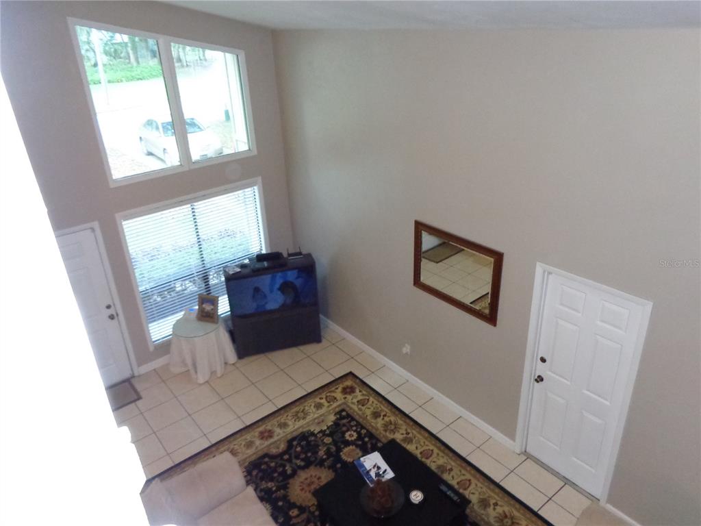 1120 Southwest 19th Place Gainesville, FL 32601 - Photo 4 of 30 a living room with a couch and a rug
