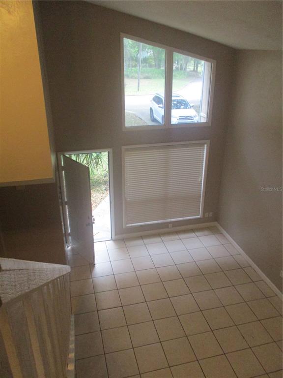 1120 Southwest 19th Place Gainesville, FL 32601 - Photo 10 of 30 a view of an empty room with a window