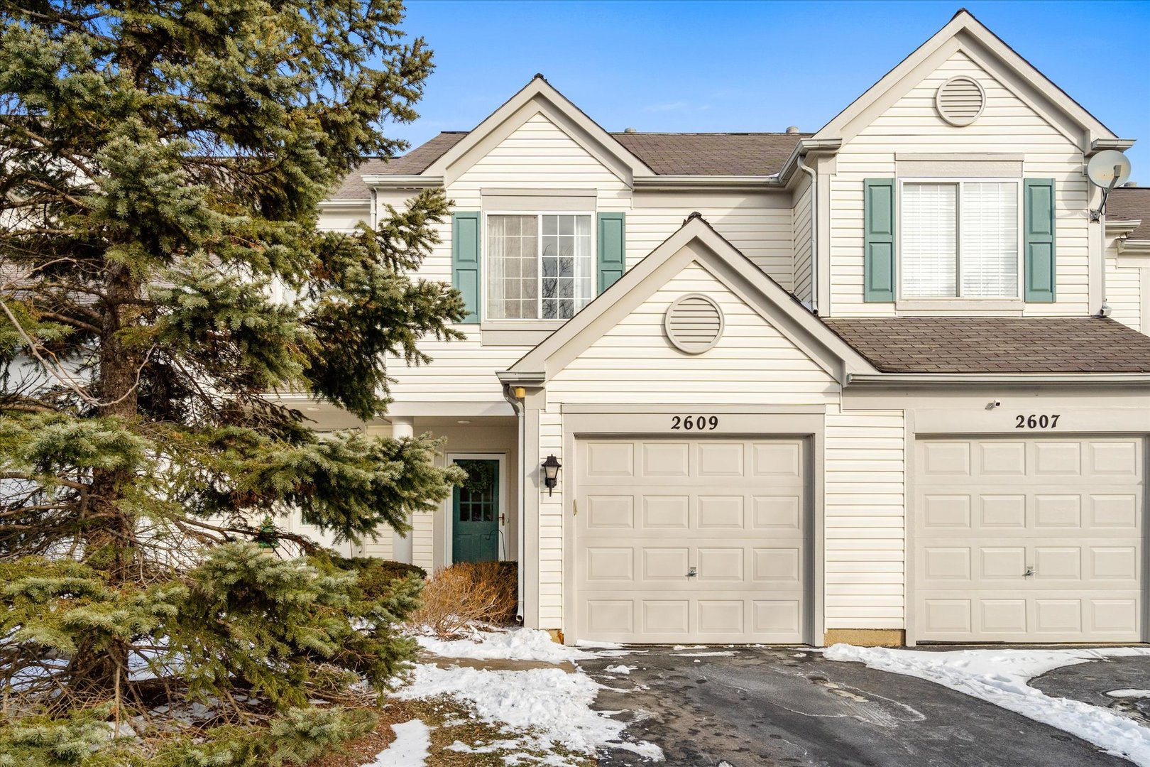 2609 Carrolwood Road, Unit 2609 Naperville, IL 60540 - Photo 1 of 17 a front view of a house with a yard