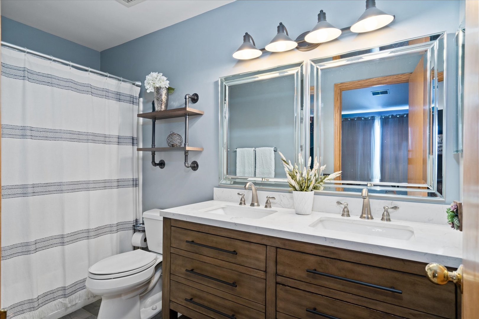 2609 Carrolwood Road, Unit 2609 Naperville, IL 60540 - Photo 12 of 17 a bathroom with a double vanity sink mirror and toilet
