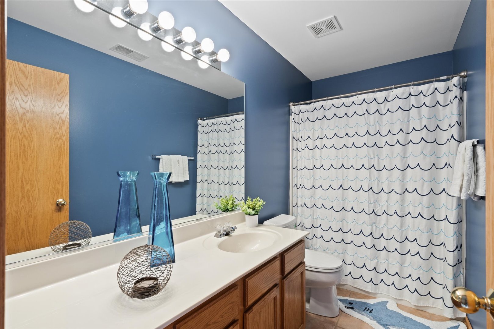 2609 Carrolwood Road, Unit 2609 Naperville, IL 60540 - Photo 14 of 17 a bathroom with a sink toilet and shower