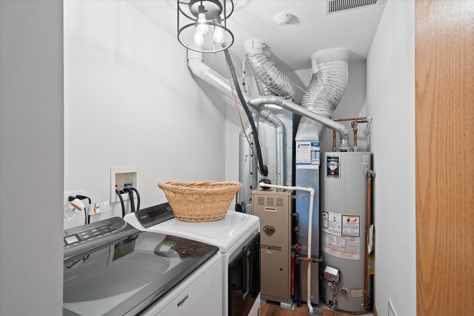 2609 Carrolwood Road, Unit 2609 Naperville, IL 60540 - Photo 15 of 17 a kitchen with a stove and a chandelier