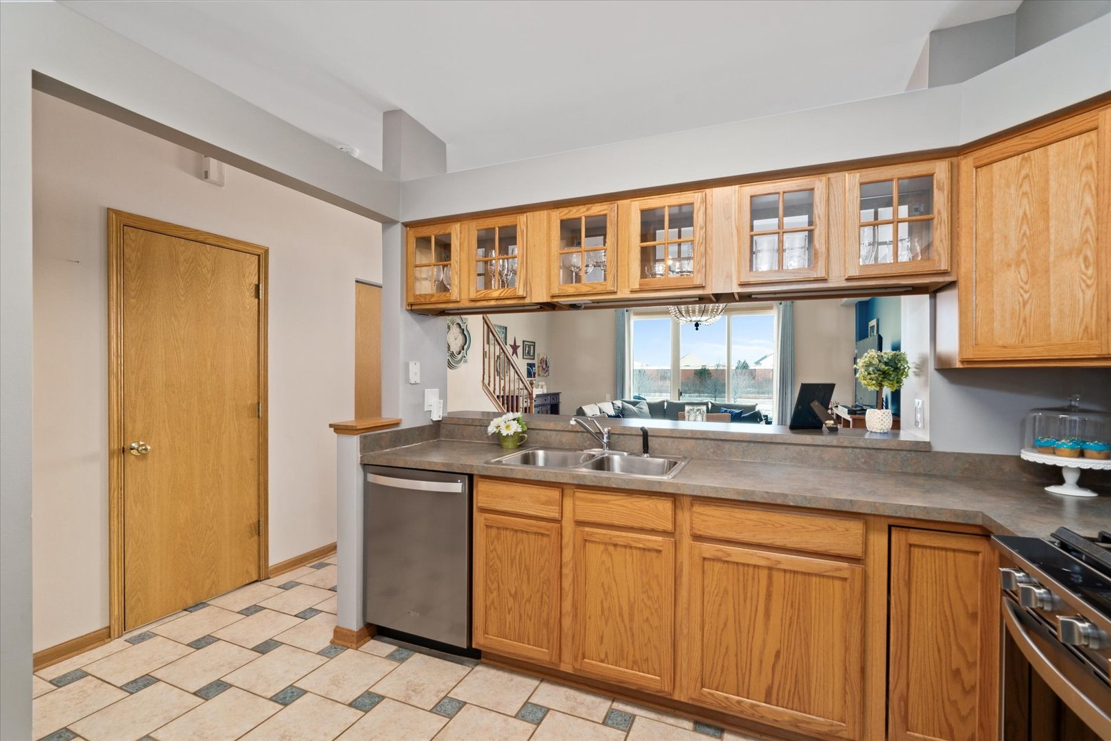 2609 Carrolwood Road, Unit 2609 Naperville, IL 60540 - Photo 4 of 17 a kitchen with stainless steel appliances granite countertop a sink and cabinets