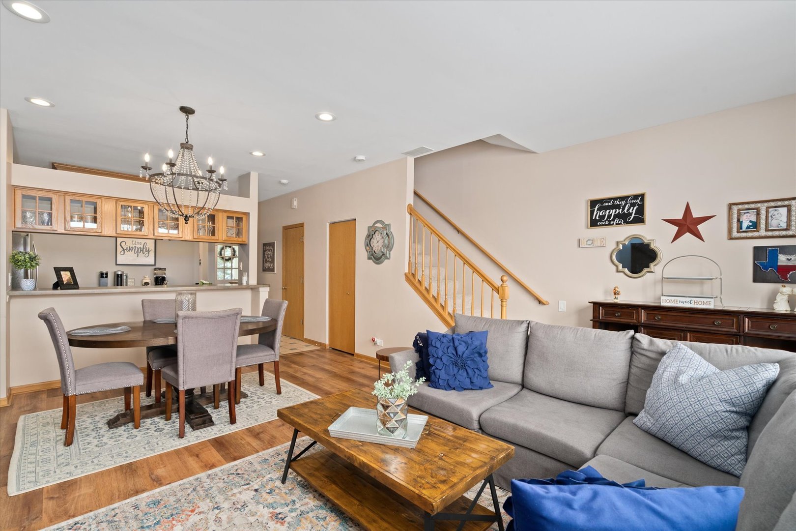 2609 Carrolwood Road, Unit 2609 Naperville, IL 60540 - Photo 8 of 17 a living room with furniture and a chandelier