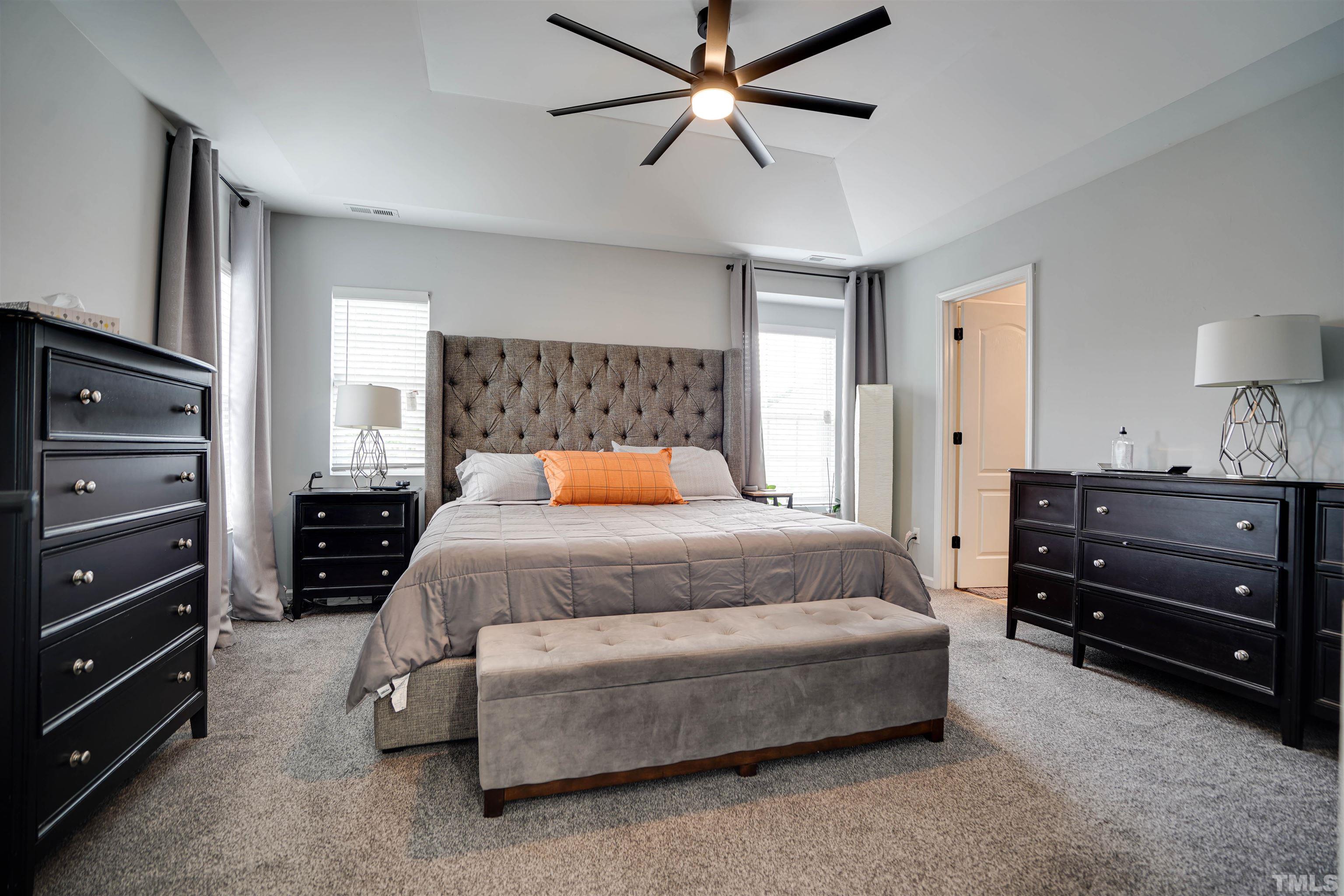 3626 Willano Way Raleigh, NC 27610 - Photo 12 of 20 a bedroom with a bed and a dresser