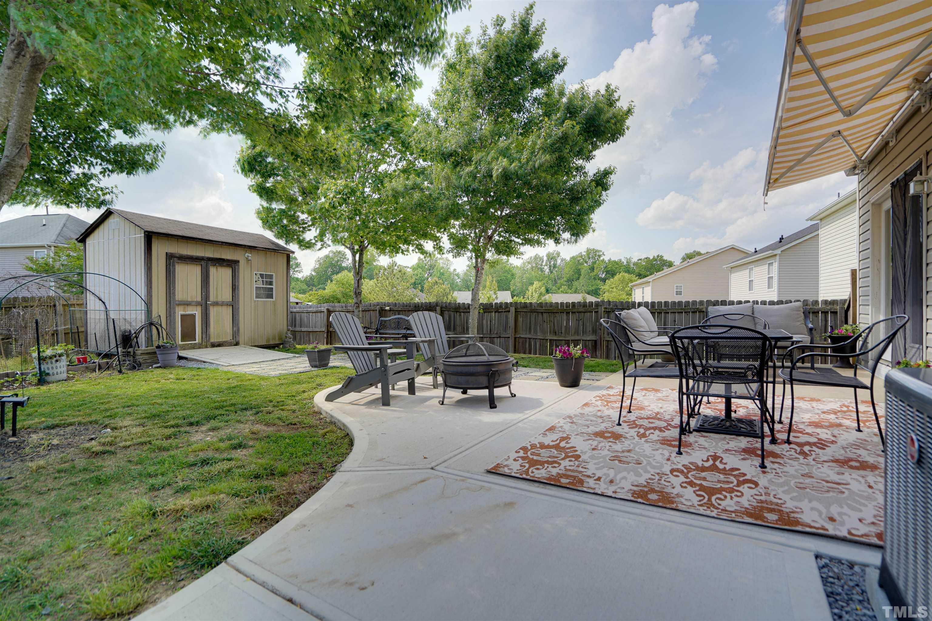 3626 Willano Way Raleigh, NC 27610 - Photo 17 of 20 a view of a backyard with sitting area furniture and garden