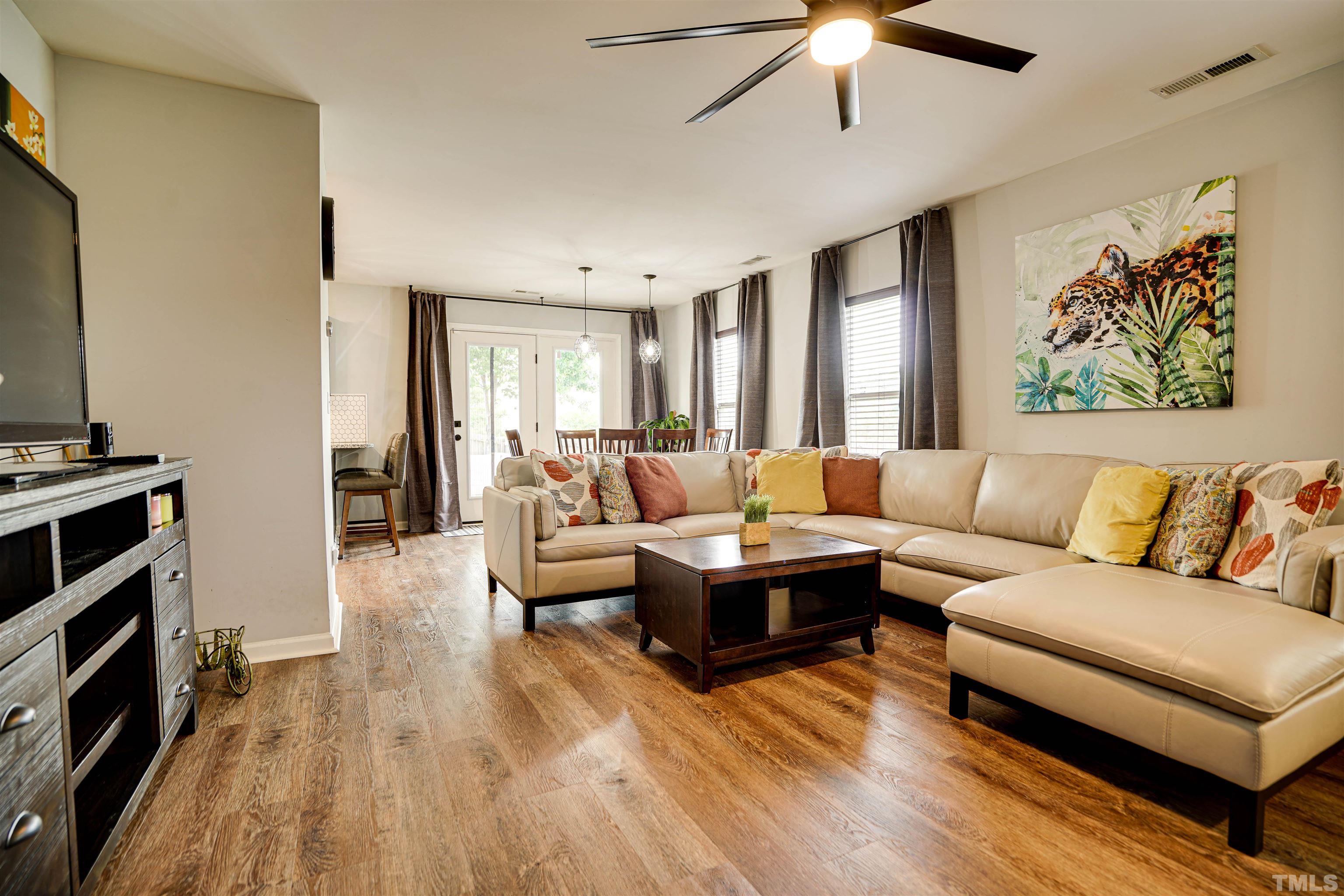 3626 Willano Way Raleigh, NC 27610 - Photo 5 of 20 a living room with furniture and a flat screen tv